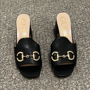 Black leather heels. 8